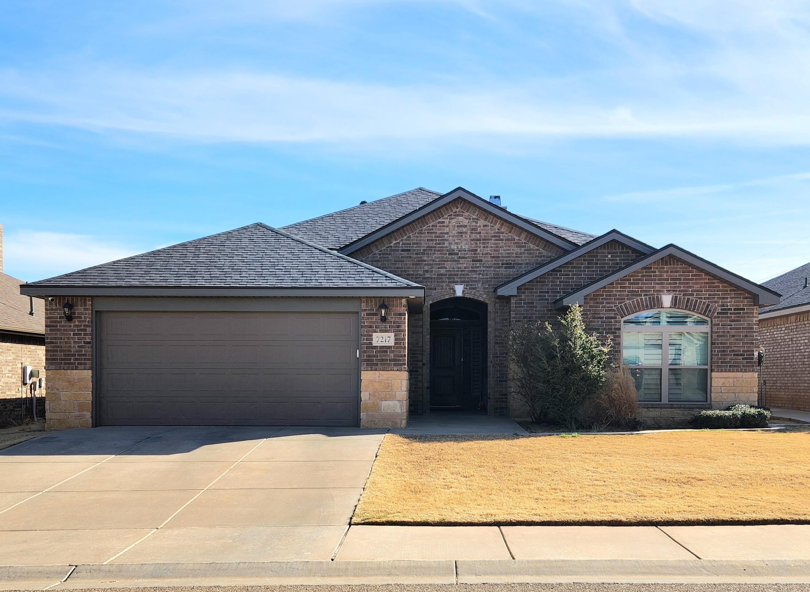 7217 91st Street Lubbock, TX 79424 - Photo 1 of 27 front view of a house with yard