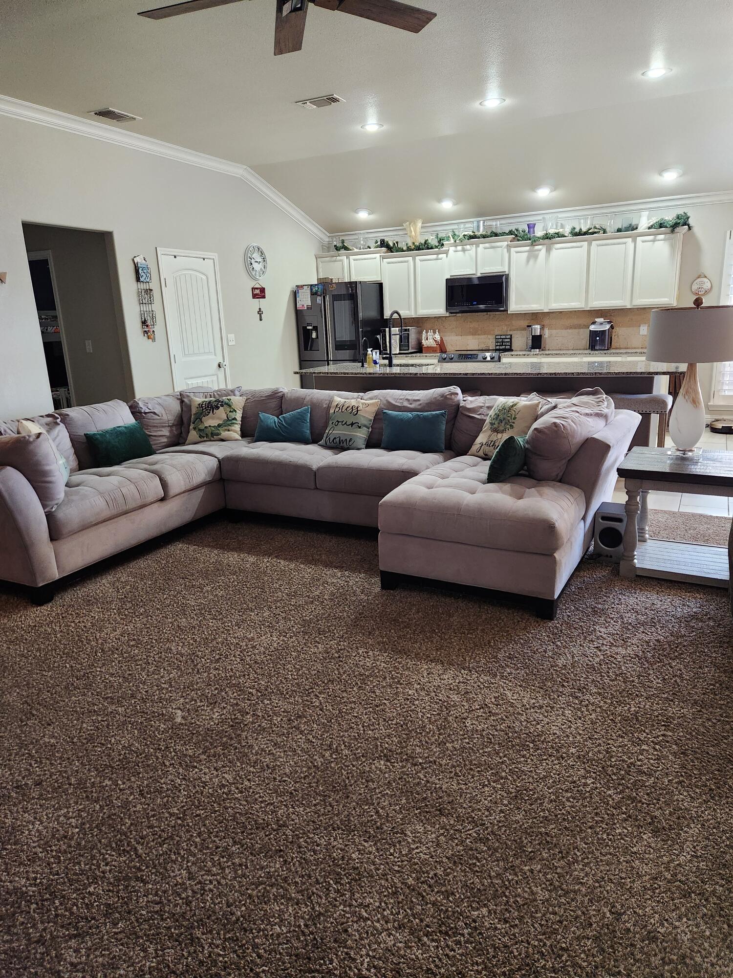 7217 91st Street Lubbock, TX 79424 - Photo 12 of 27 a living room with furniture and a couch