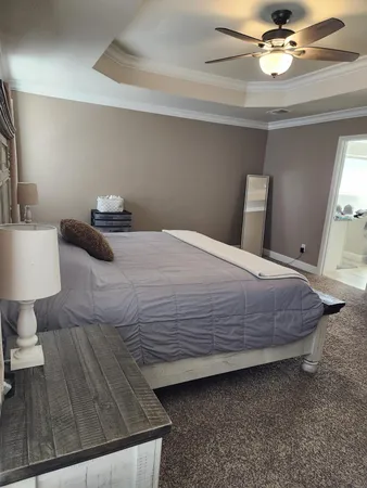 a bedroom with a bed and a table