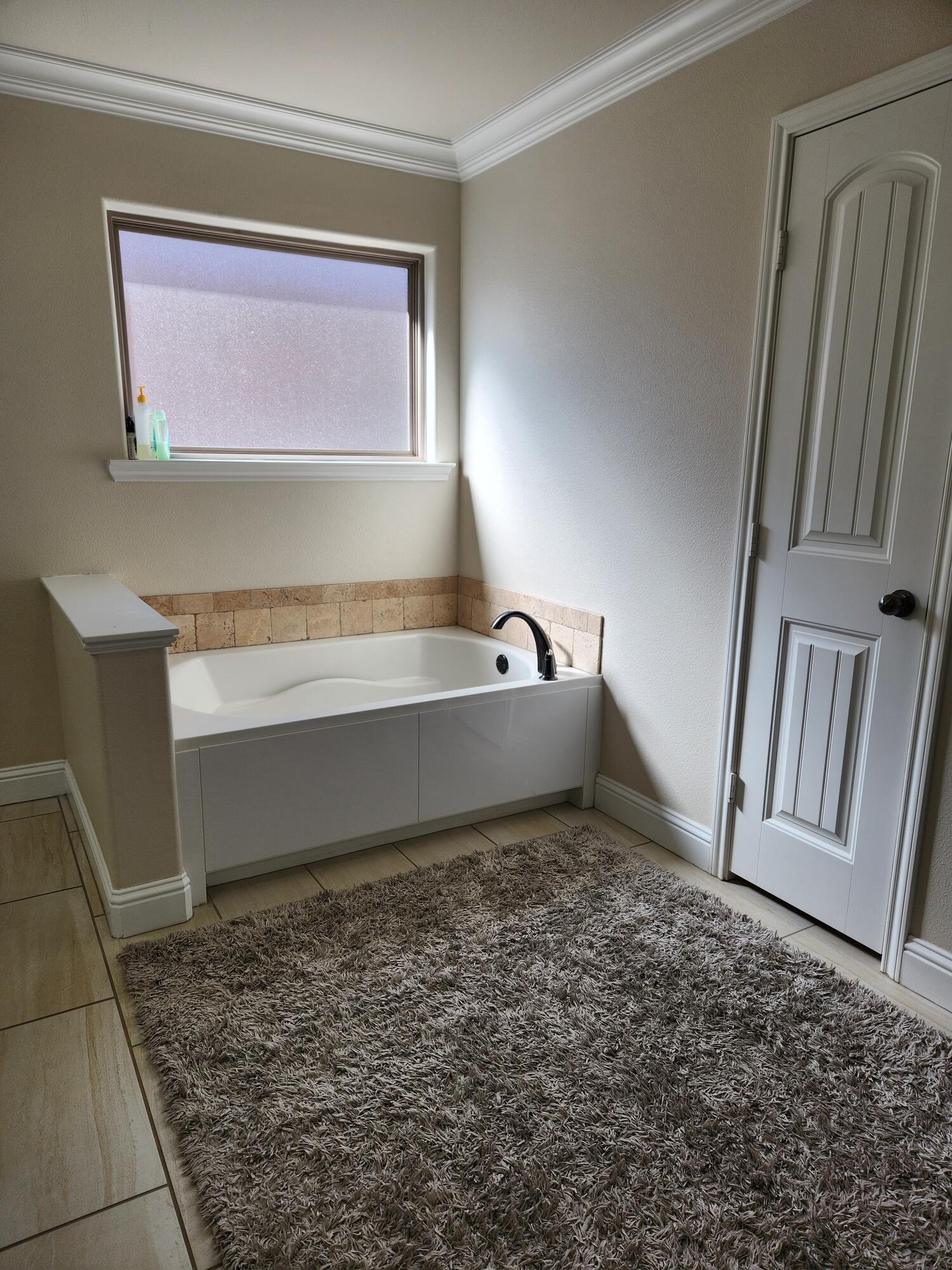 7217 91st Street Lubbock, TX 79424 - Photo 21 of 27 a view of a room with a sink and a window