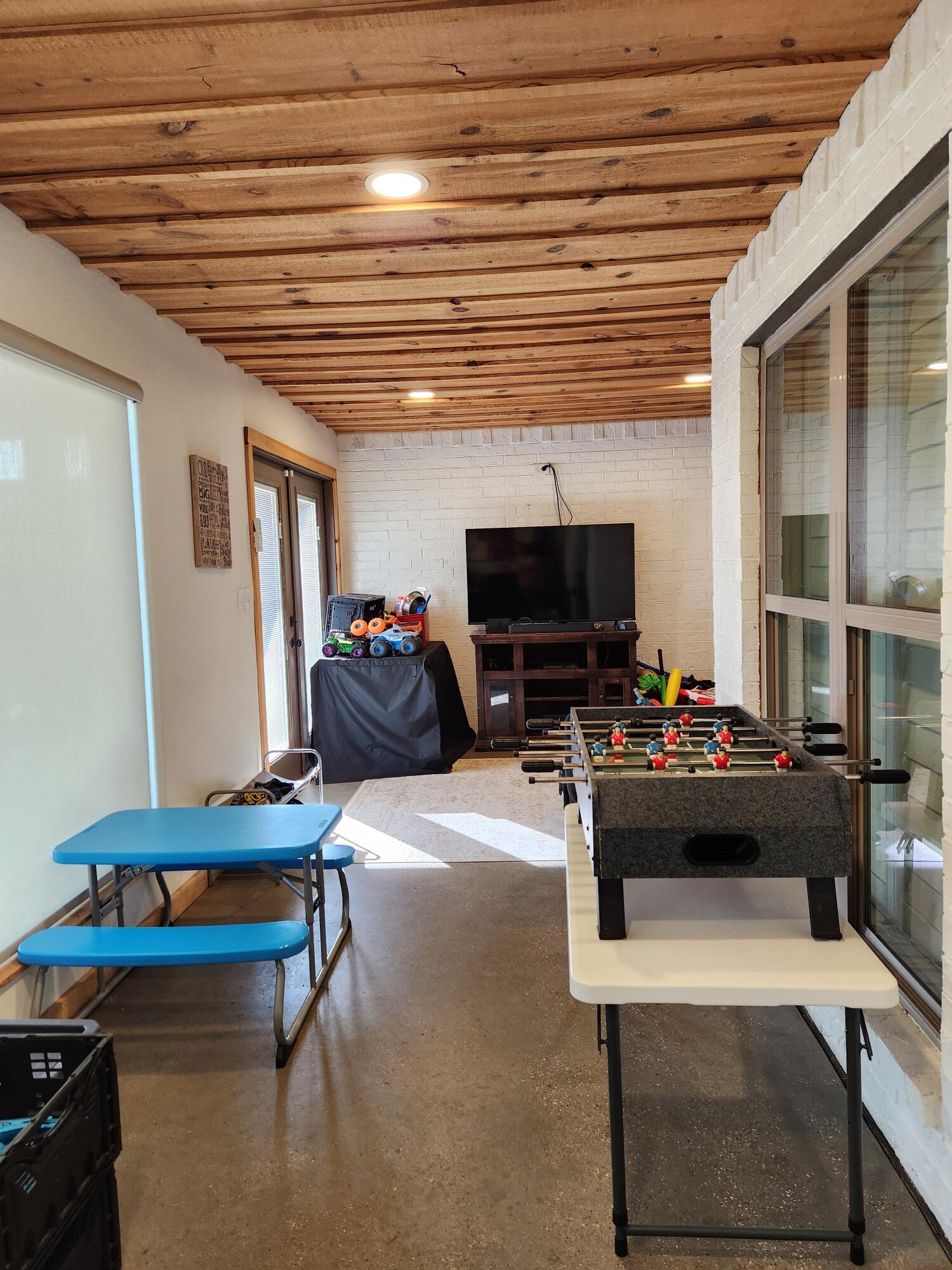 7217 91st Street Lubbock, TX 79424 - Photo 24 of 27 a living room with furniture and a flat screen tv