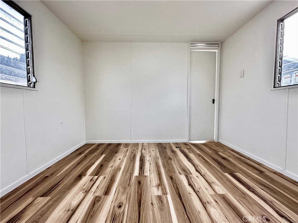 6426 Valley View Street, Unit 9 Joshua Tree, CA 92252 - Photo 11 of 23 a view of wooden floor in a room