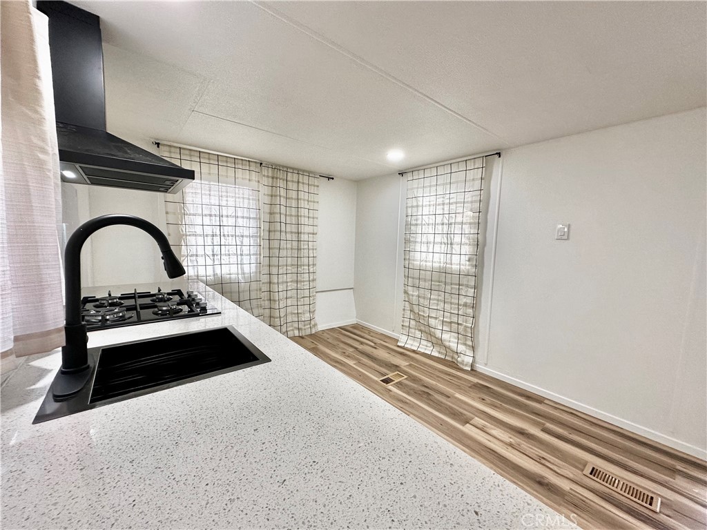 6426 Valley View Street, Unit 9 Joshua Tree, CA 92252 - Photo 17 of 23 a view of a livingroom with a fireplace and a window