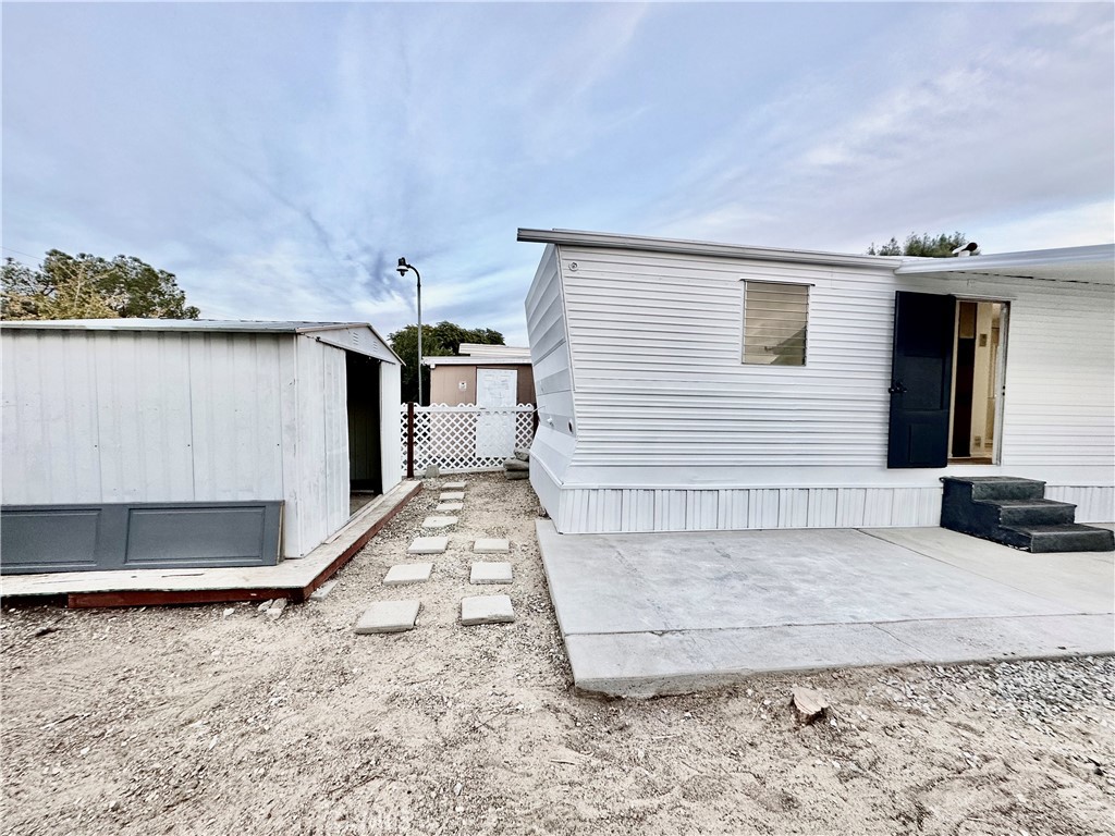 6426 Valley View Street, Unit 9 Joshua Tree, CA 92252 - Photo 19 of 23 a view of a house with a snow in the yard