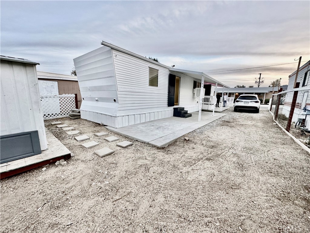 6426 Valley View Street, Unit 9 Joshua Tree, CA 92252 - Photo 20 of 23 a view of a livingroom with kitchen and furniture