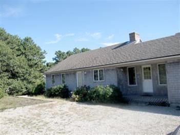 345 Pilgrim Spring Road Wellfleet, MA 02667 - Photo 6 of 18 a front view of a house with garden