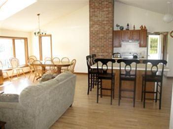 345 Pilgrim Spring Road Wellfleet, MA 02667 - Photo 8 of 18 a view of a dining room with furniture window and wooden floor