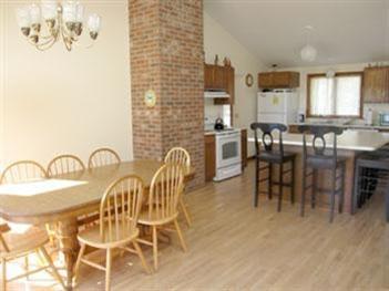 345 Pilgrim Spring Road Wellfleet, MA 02667 - Photo 9 of 18 a dining room with furniture and window