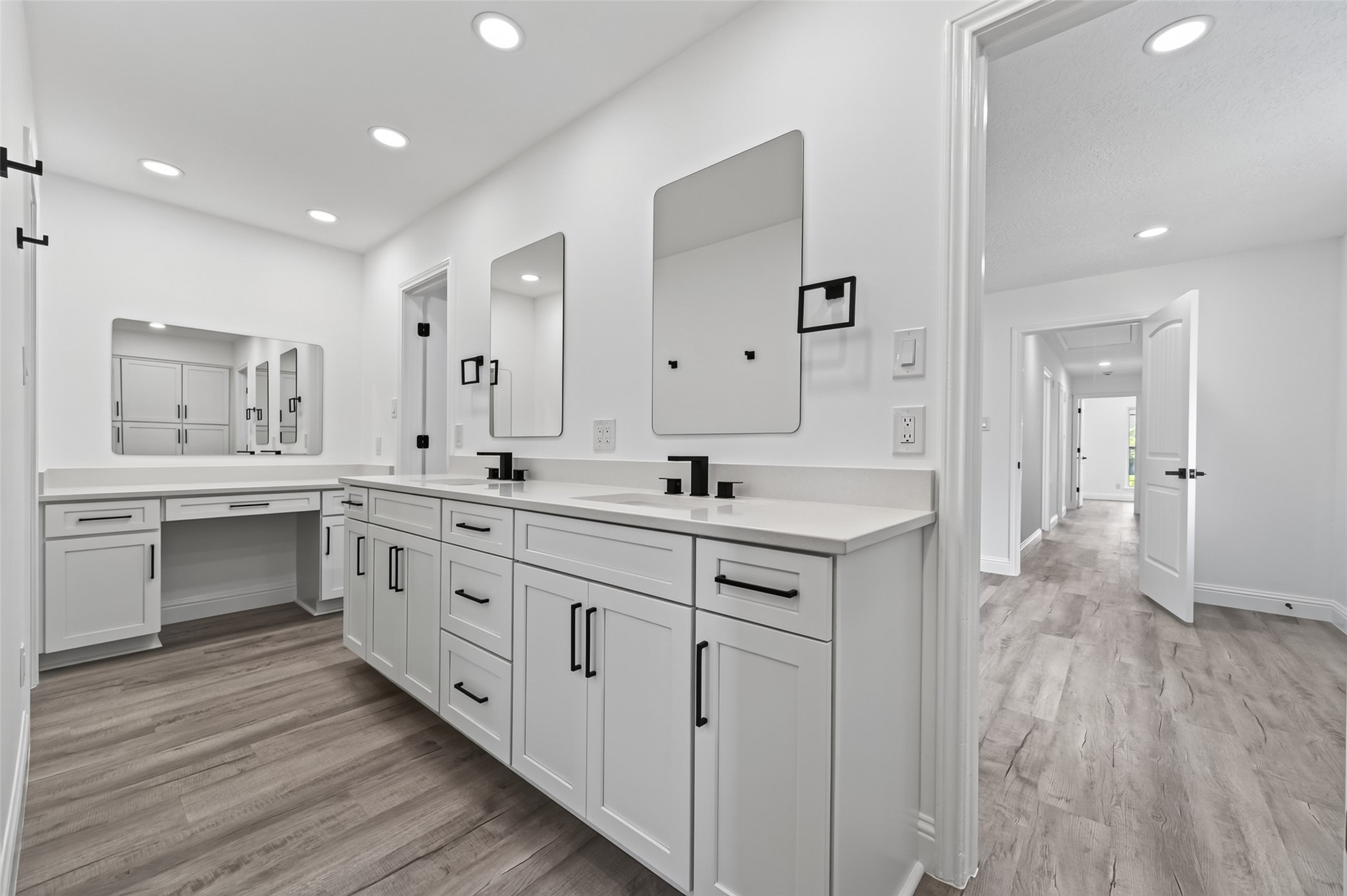 15402 Ripplestream Drive Houston, TX 77068 - Photo 38 of 50 It also includes a makeup table and storage, a double sink vanity, and sleek mirrors and hardware.
