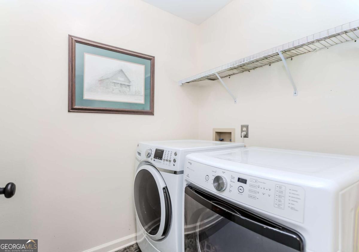6441 Hog Mountain Road Bogart, GA 30622 - Photo 14 of 57 a utility room with dryer and washer