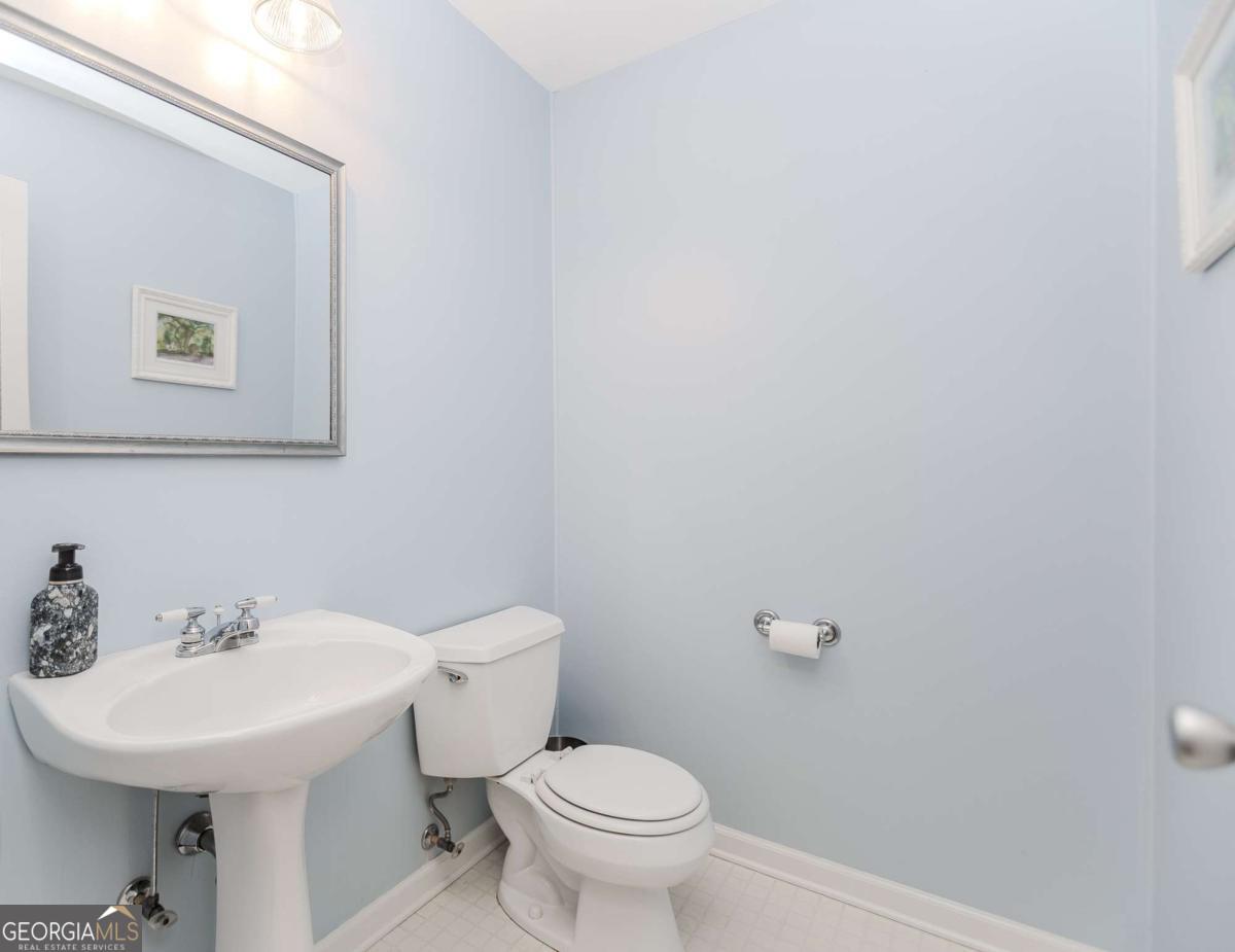 6441 Hog Mountain Road Bogart, GA 30622 - Photo 15 of 57 a bathroom with a sink mirror and toilet