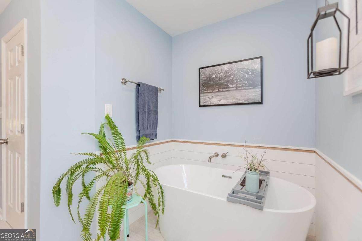 6441 Hog Mountain Road Bogart, GA 30622 - Photo 19 of 57 a bathroom with a tub and a sink