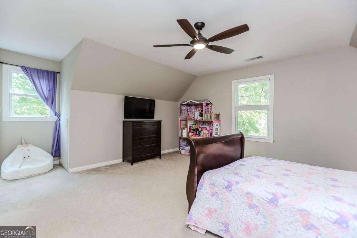 6441 Hog Mountain Road Bogart, GA 30622 - Photo 27 of 57 a bedroom with a bed and a window