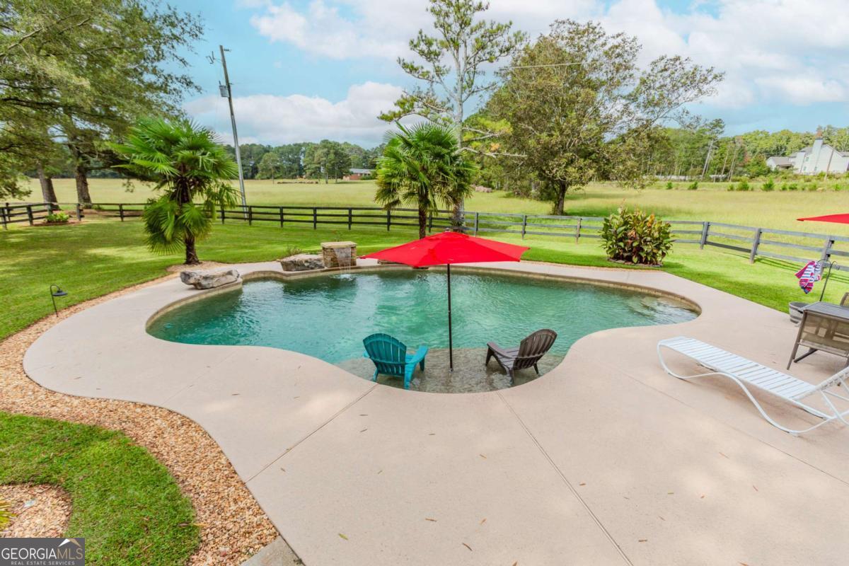 6441 Hog Mountain Road Bogart, GA 30622 - Photo 29 of 57 a view of a swimming pool and outdoor space