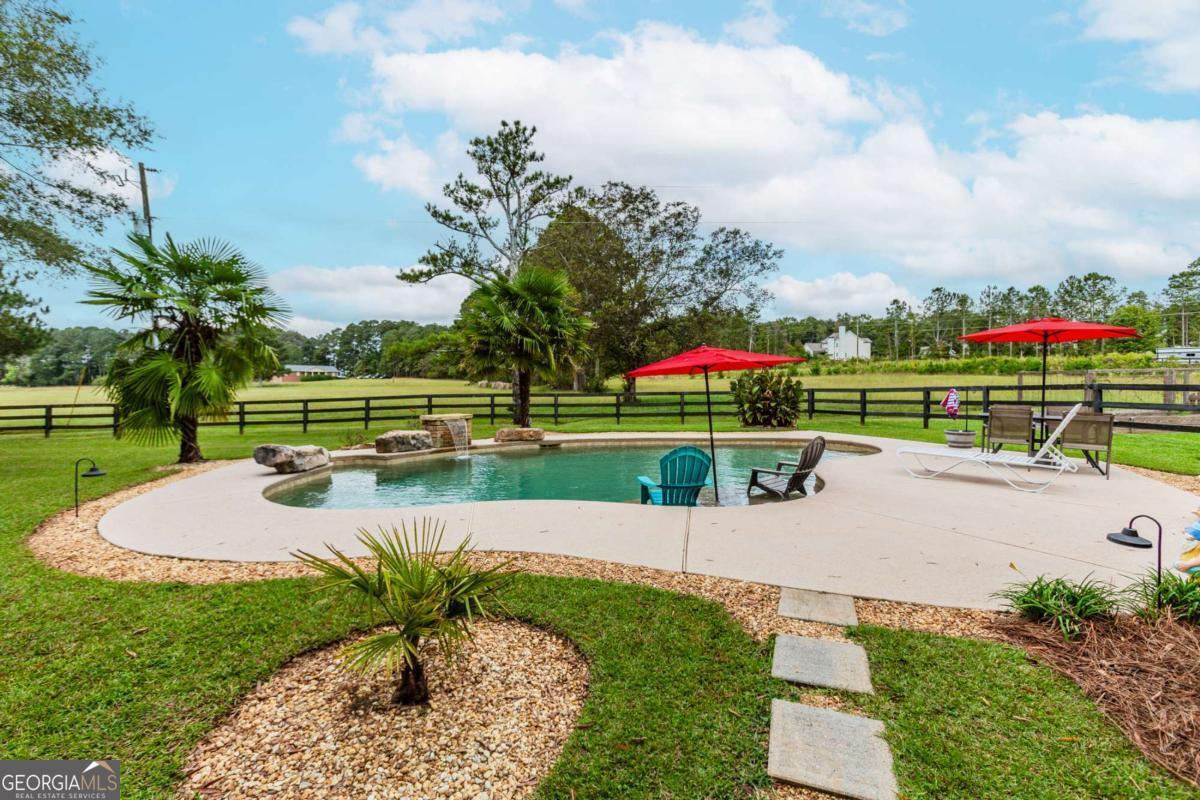 6441 Hog Mountain Road Bogart, GA 30622 - Photo 30 of 57 a view of yard with swimming pool and green space