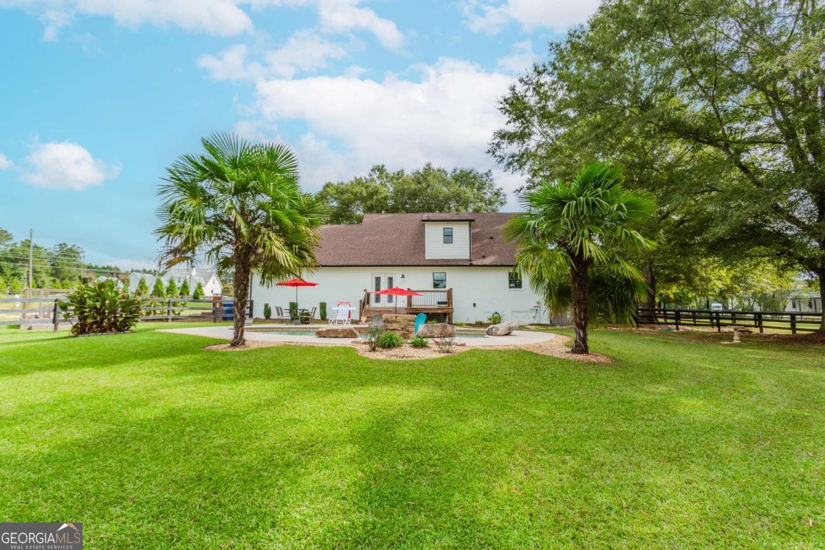 6441 Hog Mountain Road Bogart, GA 30622 - Photo 34 of 57 a view of a house with a yard and sitting area
