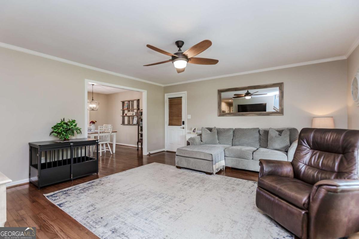 6441 Hog Mountain Road Bogart, GA 30622 - Photo 4 of 57 a living room with furniture and a wooden floor