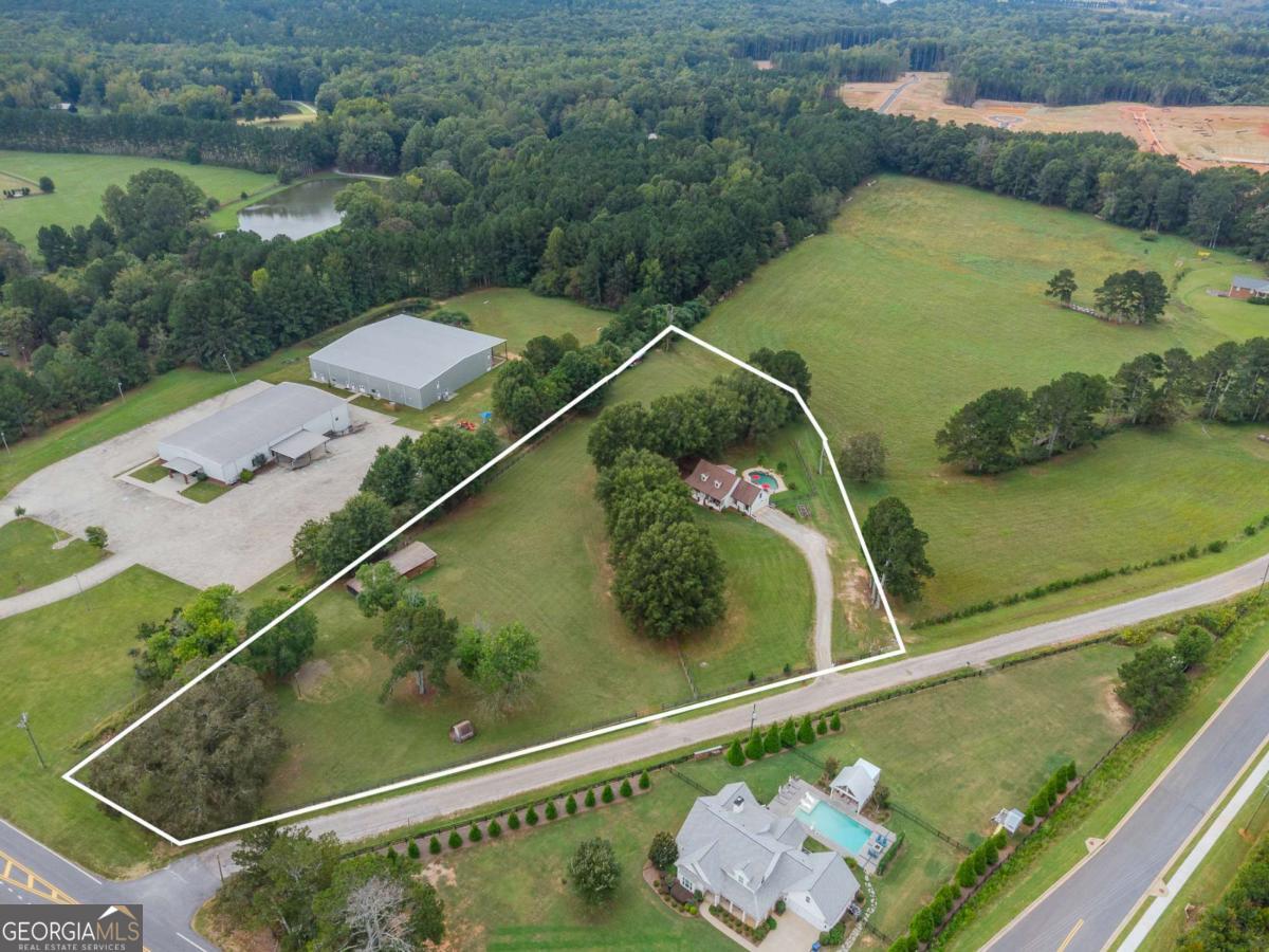 6441 Hog Mountain Road Bogart, GA 30622 - Photo 46 of 57 a view of a swimming pool with a yard