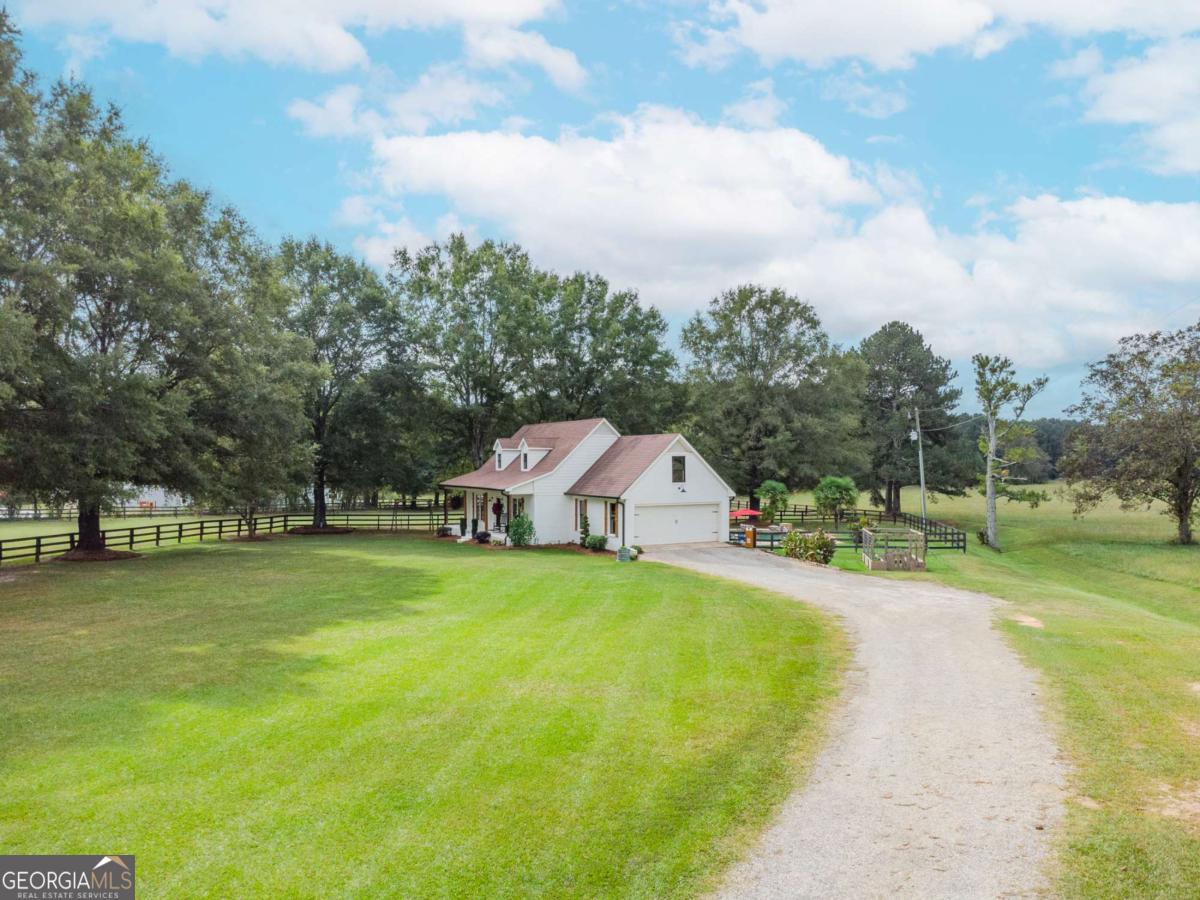 6441 Hog Mountain Road Bogart, GA 30622 - Photo 55 of 57 a view of a house with a big yard and basketball court