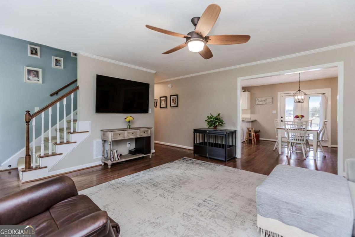 6441 Hog Mountain Road Bogart, GA 30622 - Photo 6 of 57 a living room with furniture and a flat screen tv