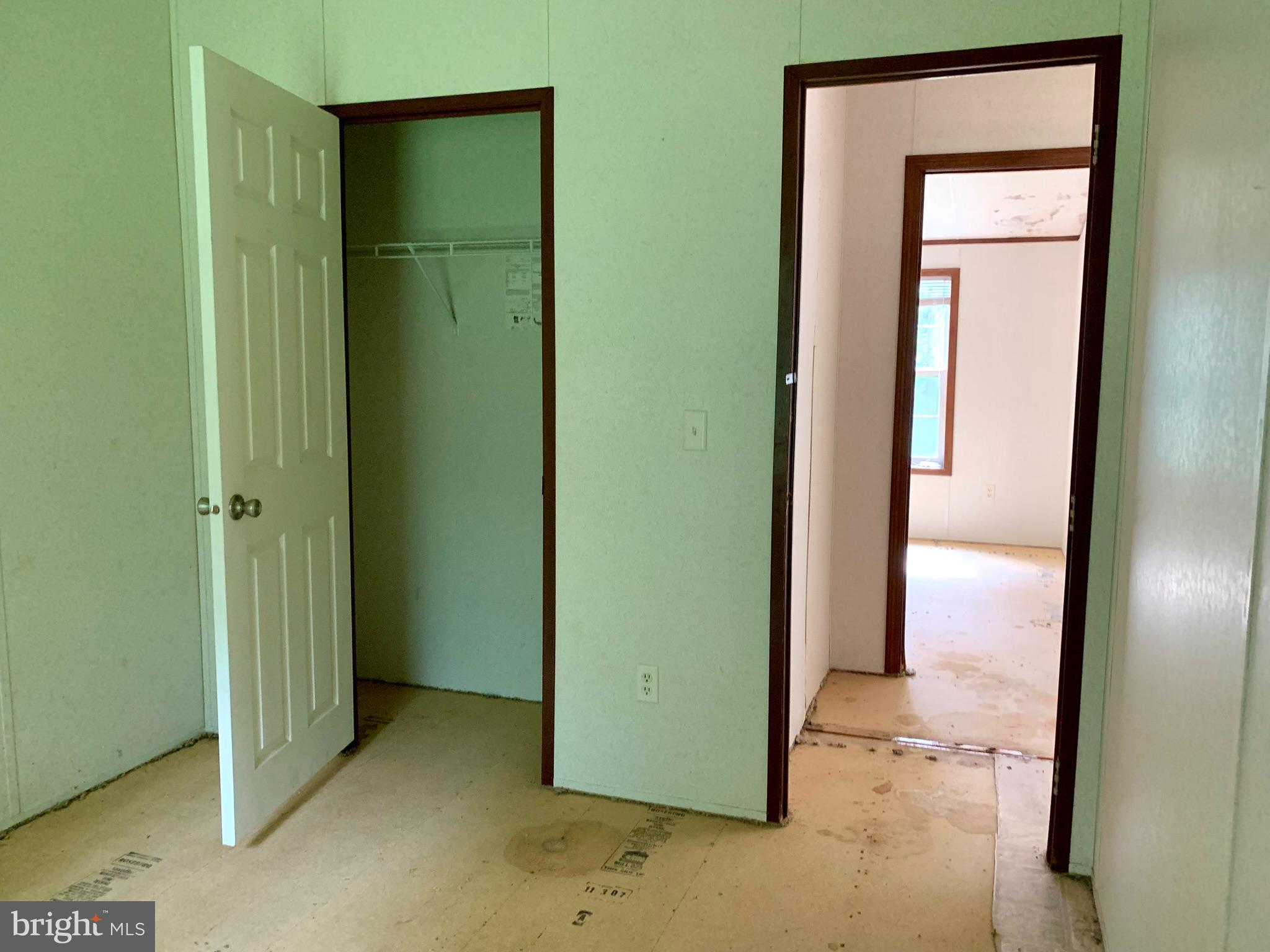 776 Pony Track Road Camden Wyoming, DE 19934 - Photo 17 of 18 a view of an empty room with closet and a bathroom