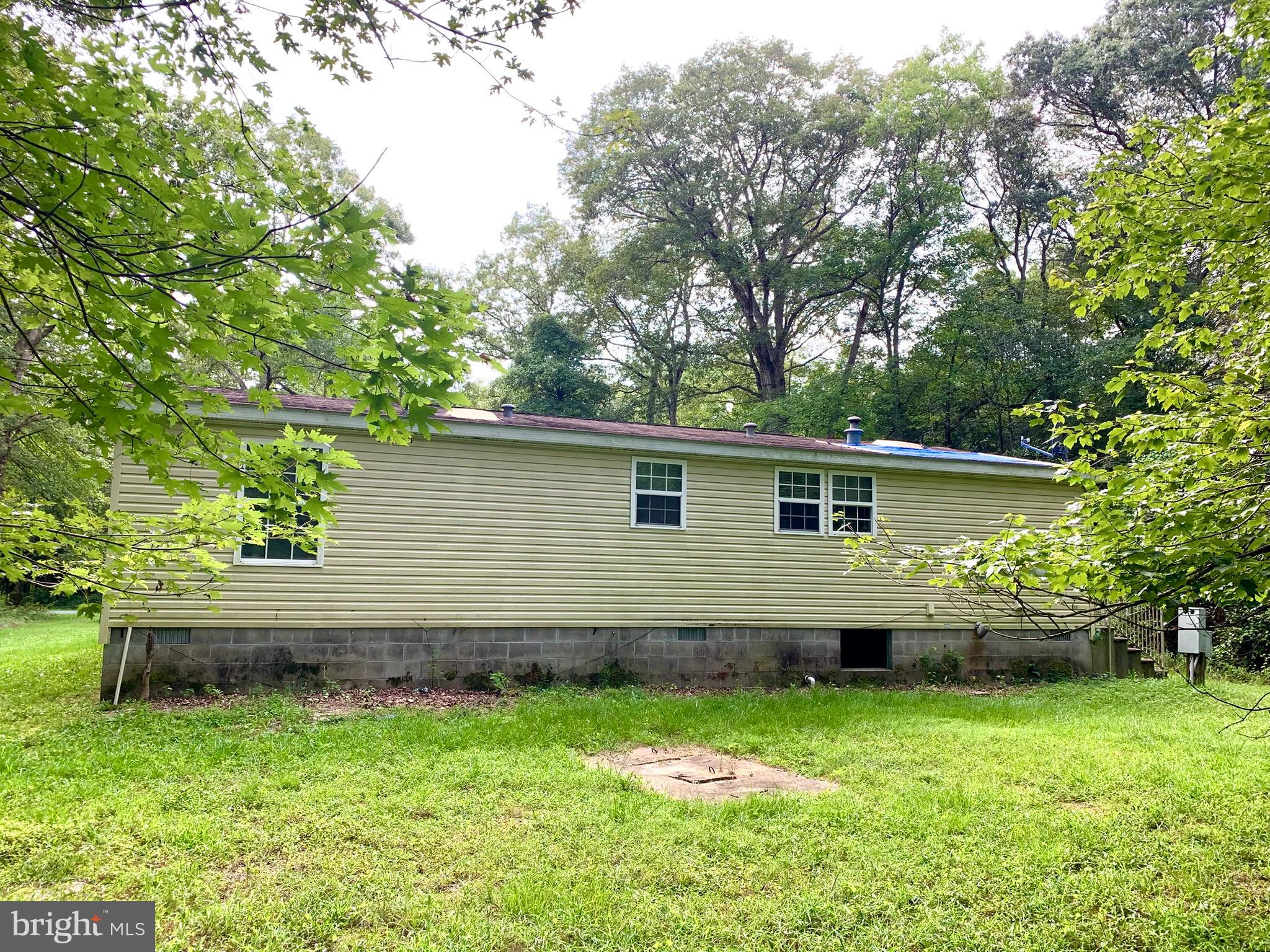 776 Pony Track Road Camden Wyoming, DE 19934 - Photo 2 of 18 a backyard of a house with lots of green space