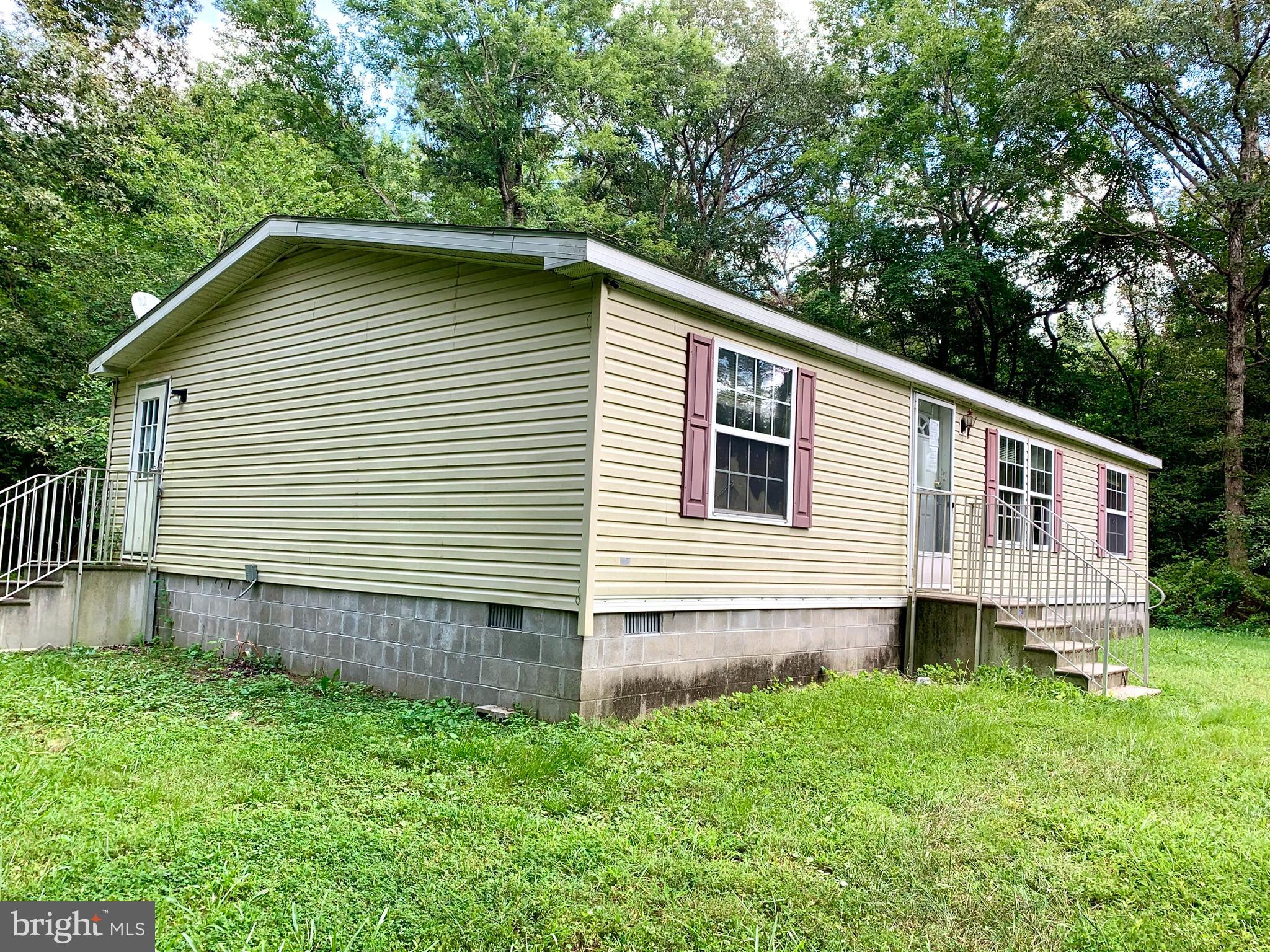 776 Pony Track Road Camden Wyoming, DE 19934 - Photo 3 of 18 a backyard of a house with wooden deck and barbeque oven