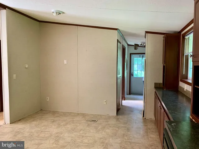 a kitchen with stainless steel appliances granite countertop a refrigerator stove and a sink