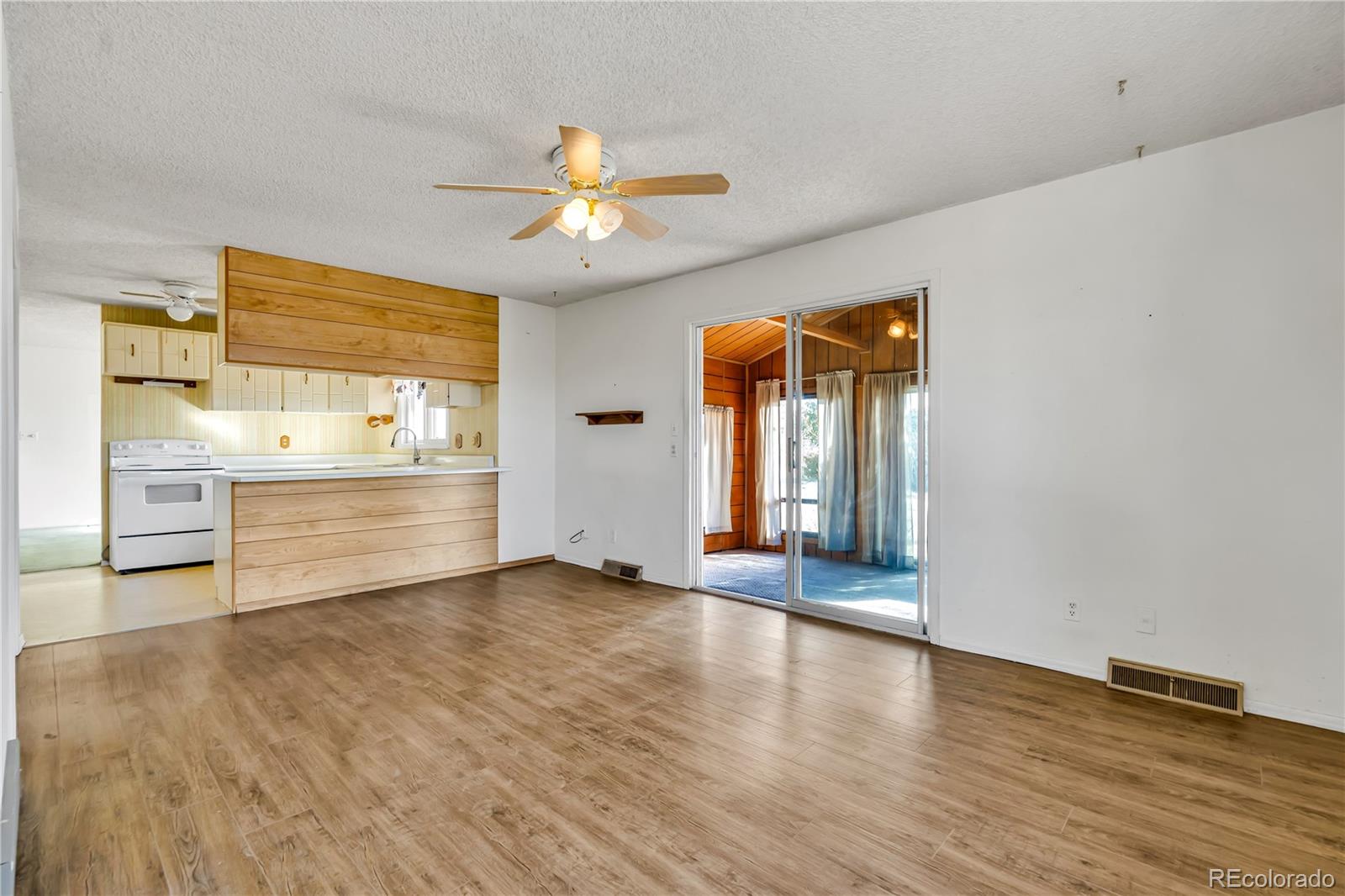 754 Highway 86 Elizabeth, CO 80107 - Photo 11 of 47 a view of an empty room with window and wooden floor