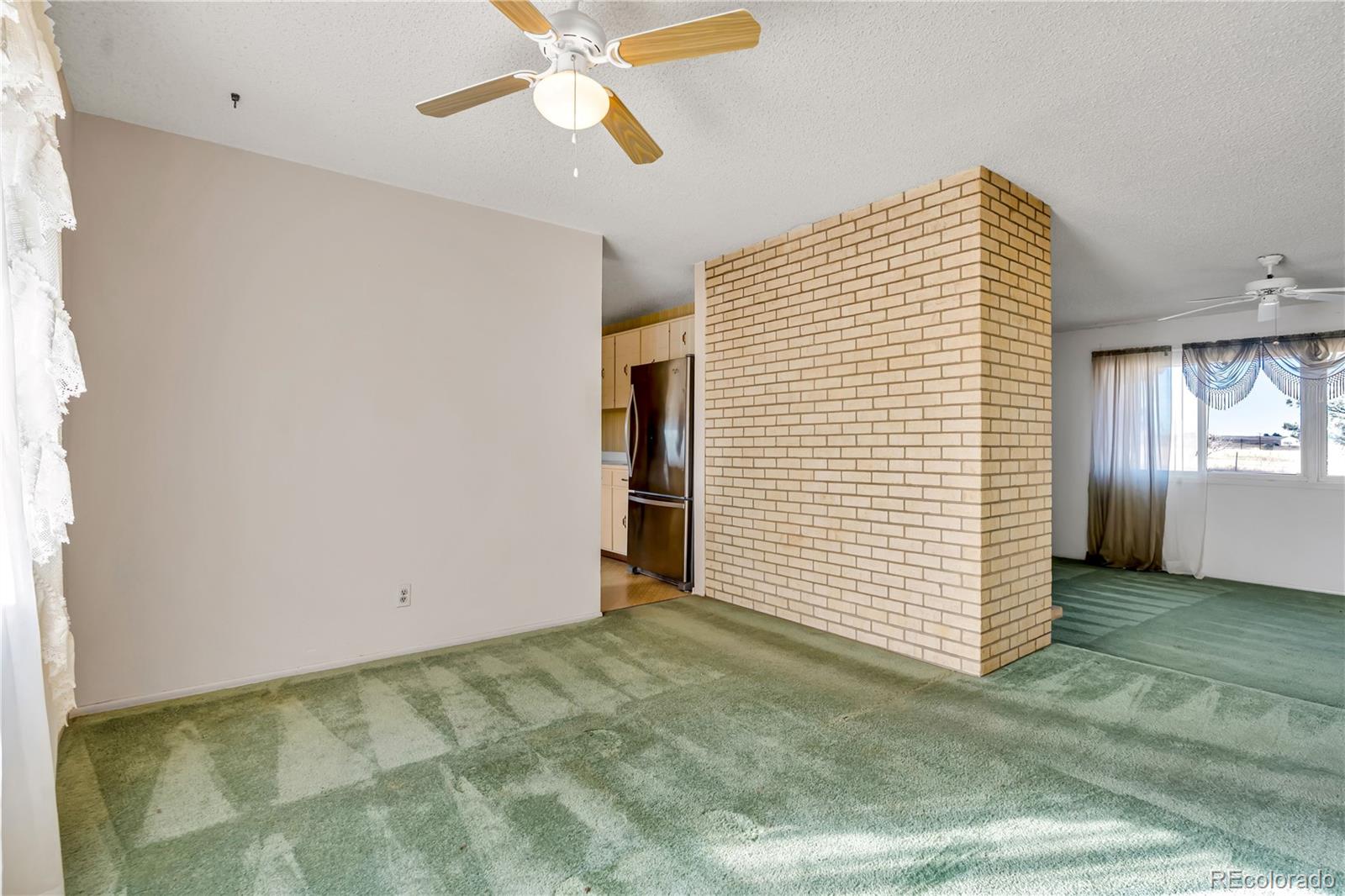 754 Highway 86 Elizabeth, CO 80107 - Photo 16 of 47 a view of a livingroom with an empty space