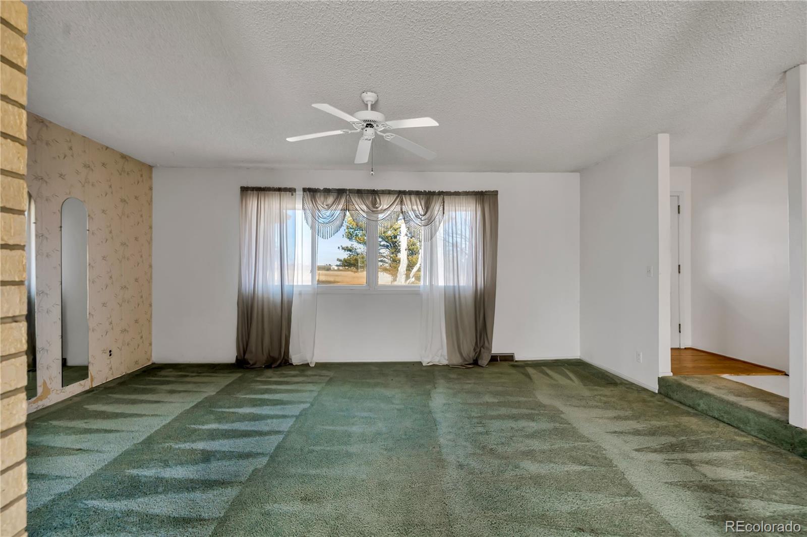 754 Highway 86 Elizabeth, CO 80107 - Photo 17 of 47 a view of entryway with wooden floor