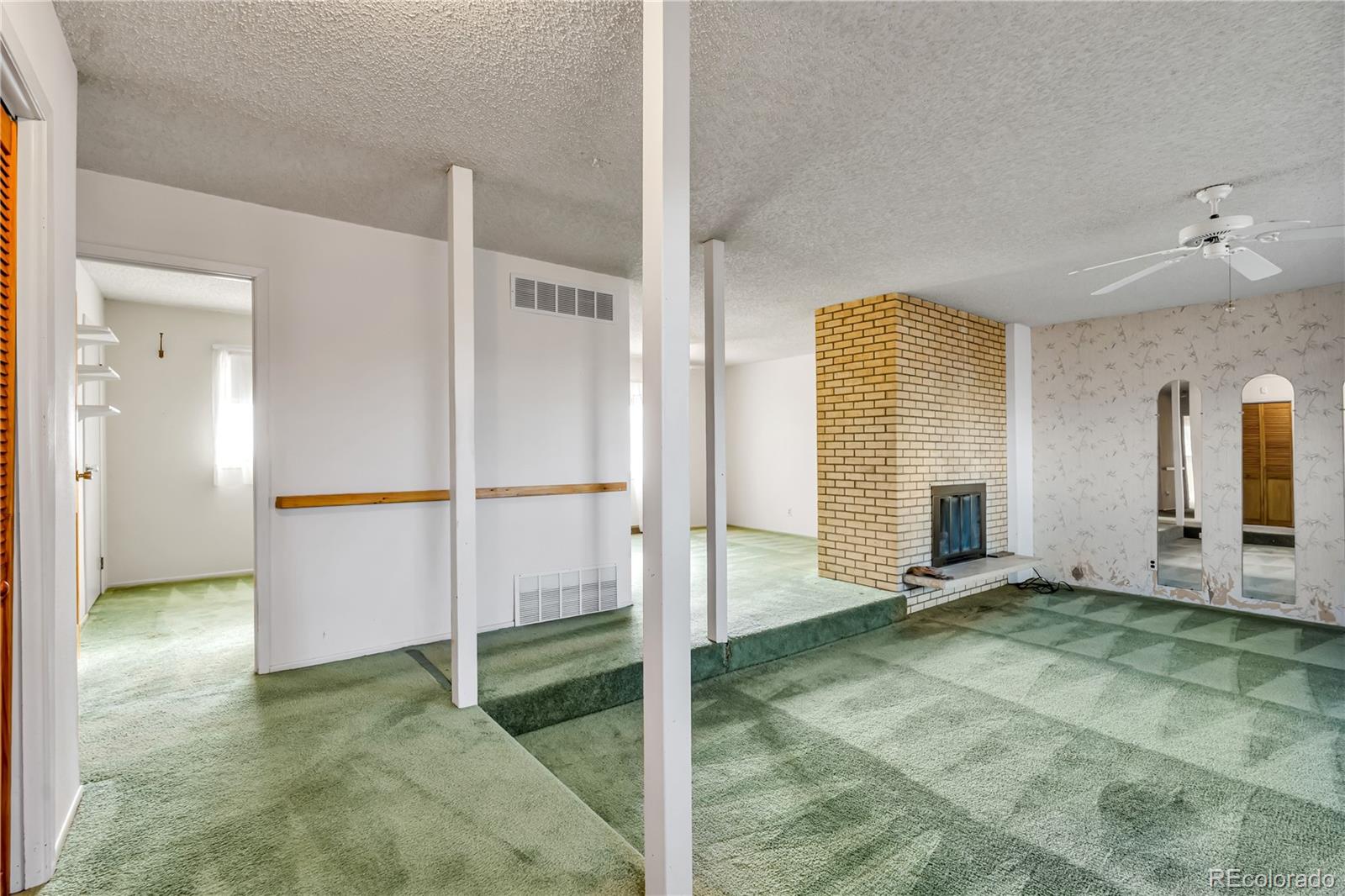 754 Highway 86 Elizabeth, CO 80107 - Photo 21 of 47 a view of a livingroom with wooden floor and a bathroom