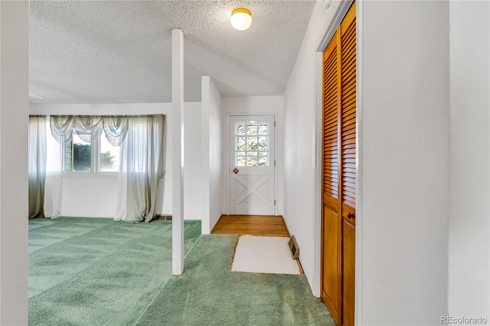 754 Highway 86 Elizabeth, CO 80107 - Photo 25 of 47 a view of entryway with wooden floor