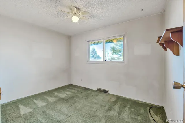 a view of front door with wooden floor and a window