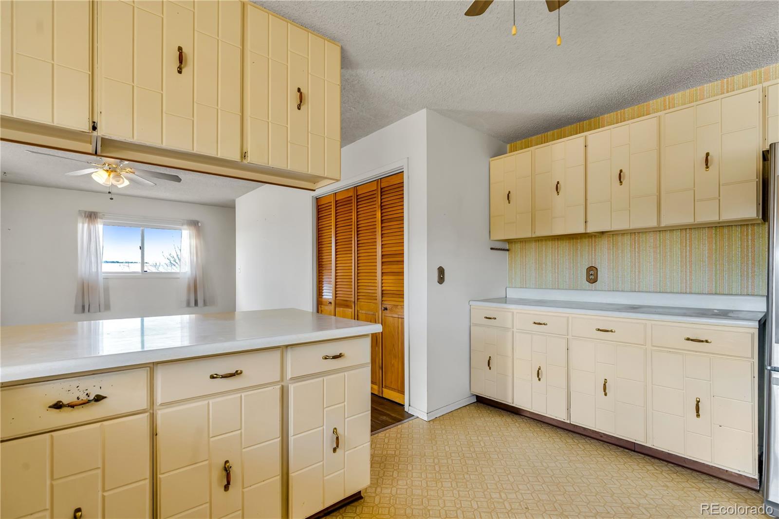 754 Highway 86 Elizabeth, CO 80107 - Photo 6 of 47 a kitchen with granite countertop white cabinets and a sink