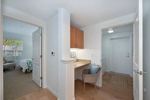 a view of a room that has a table and chair in it