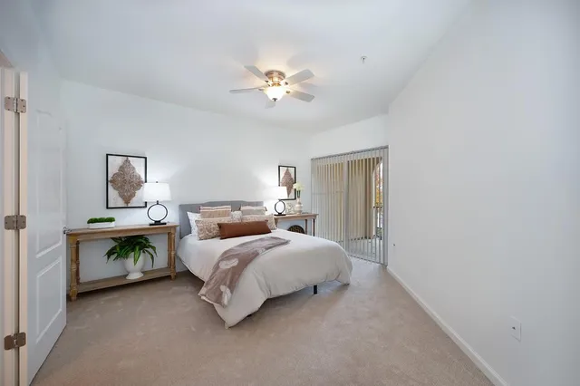 a bed room with bed and a chandelier