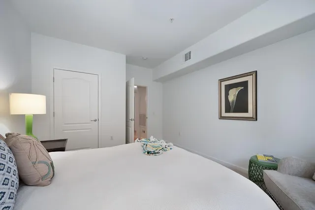 a bedroom with a bed and a couch