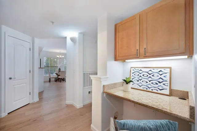 a view of living room with furniture and wooden floor