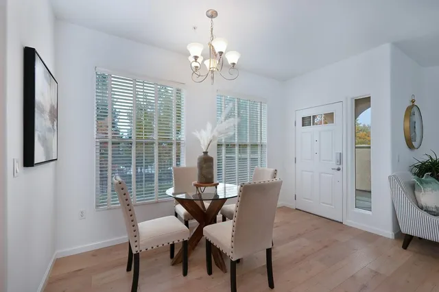 a view of a dining room with furniture window and wooden floor