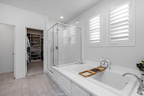 a bathroom with a tub and a sink