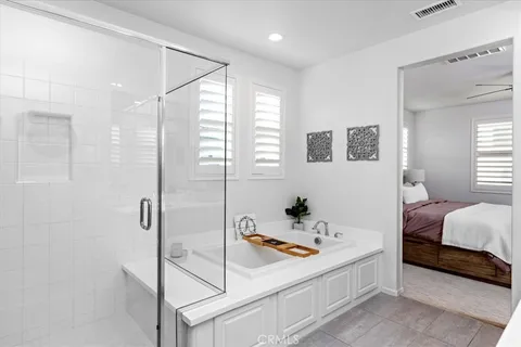 a bathroom with a tub and a shower