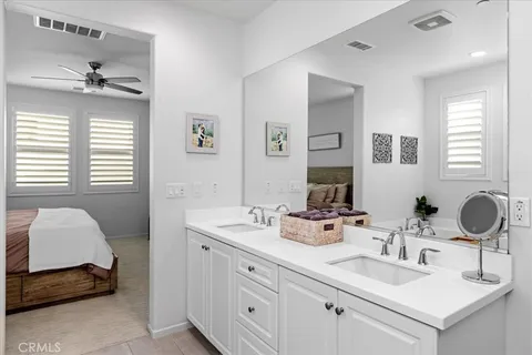 a bathroom with a sink double vanity and a mirror