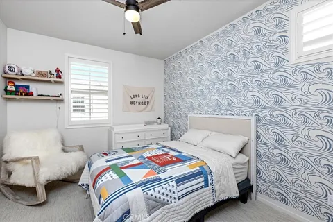 a bathroom with a sink double vanity and a toilet