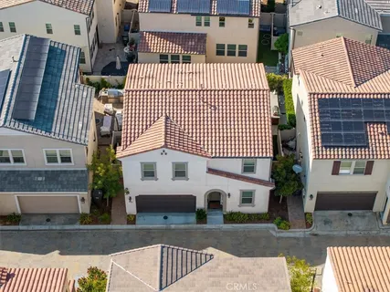 an aerial view of a house with a garden