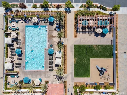 a view of a balcony with wooden floor and fence