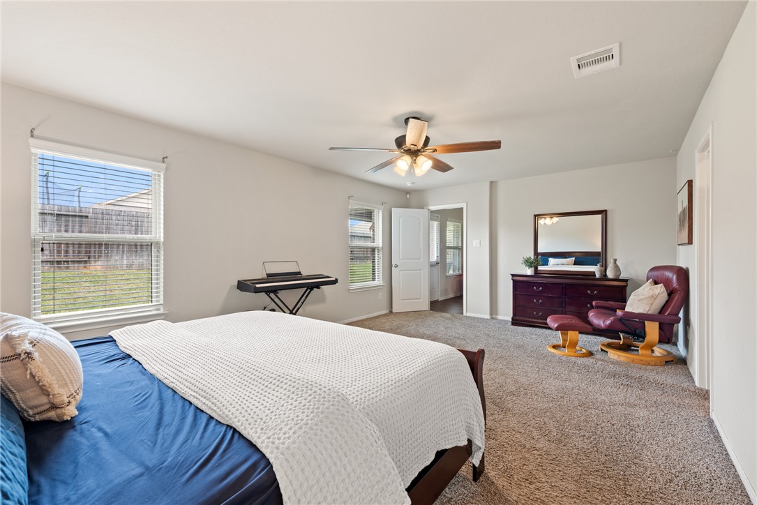 2018 Eagle View Drive Navasota, TX 77868 - Photo 15 of 28 a bedroom with a bed and wooden floor