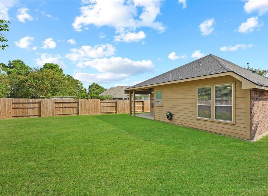 31030 Imperial Walk Lane Spring, TX 77386 - Photo 19 of 19 a front view of a house with a garden