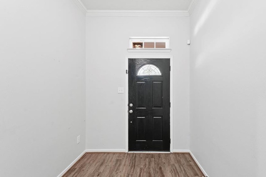 31030 Imperial Walk Lane Spring, TX 77386 - Photo 3 of 19 a view of a hallway with wooden floor