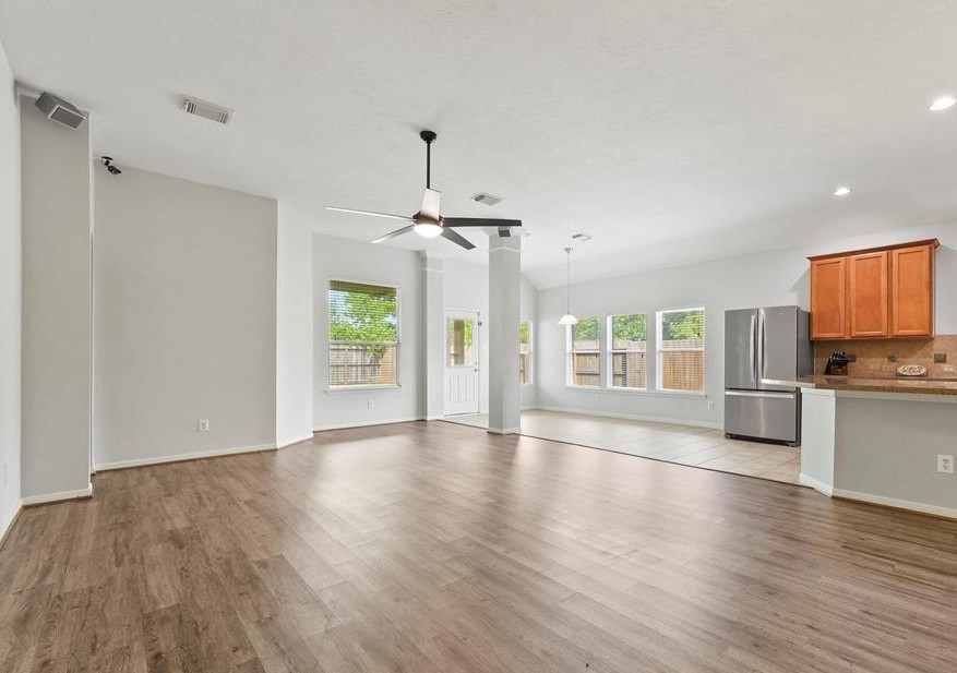 31030 Imperial Walk Lane Spring, TX 77386 - Photo 6 of 19 a view of an empty room with window and wooden floor